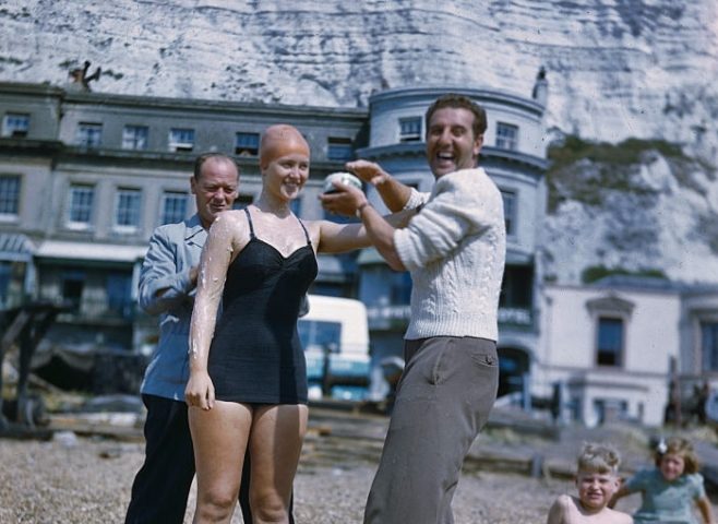 Shirley May France, the swimmer, is shown during the English Channel swim preparations, being greased up for practice swim.