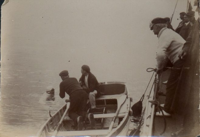 A quiet chat. Channel swimmer Wolffe with crew in channel.  Brickett in boat