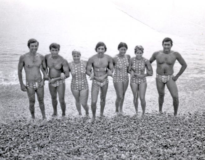 Photograph of the Egyptian Channel Swimming Team in front of the sea