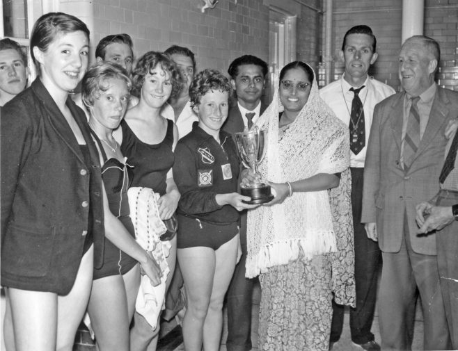 Photograph of Channel Swimmer Arati Saha Giving trophy to Dover Life Guard Swimming Club