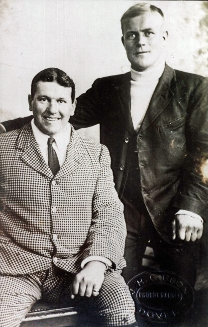 Channel Swimmer Jabez Wolffe seated, and Kellingley, in suits