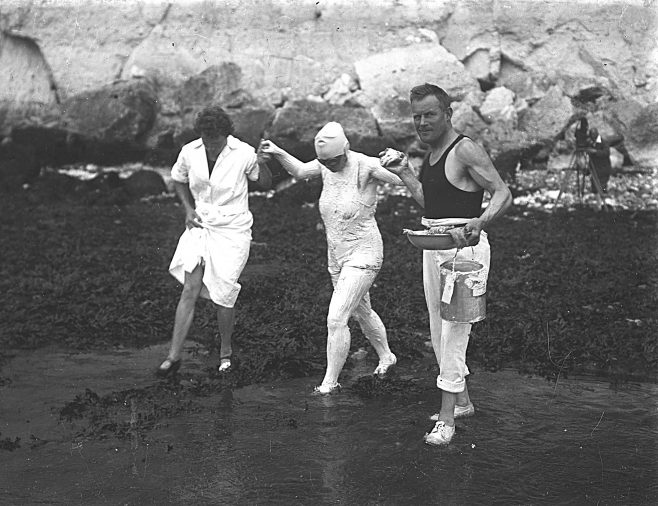 Photograph of Billy Kellingley assisting Millie Corson at the beginning of a channel swim