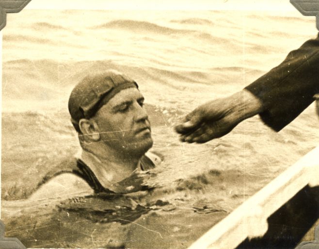 Frank Perks being fed in the sea.